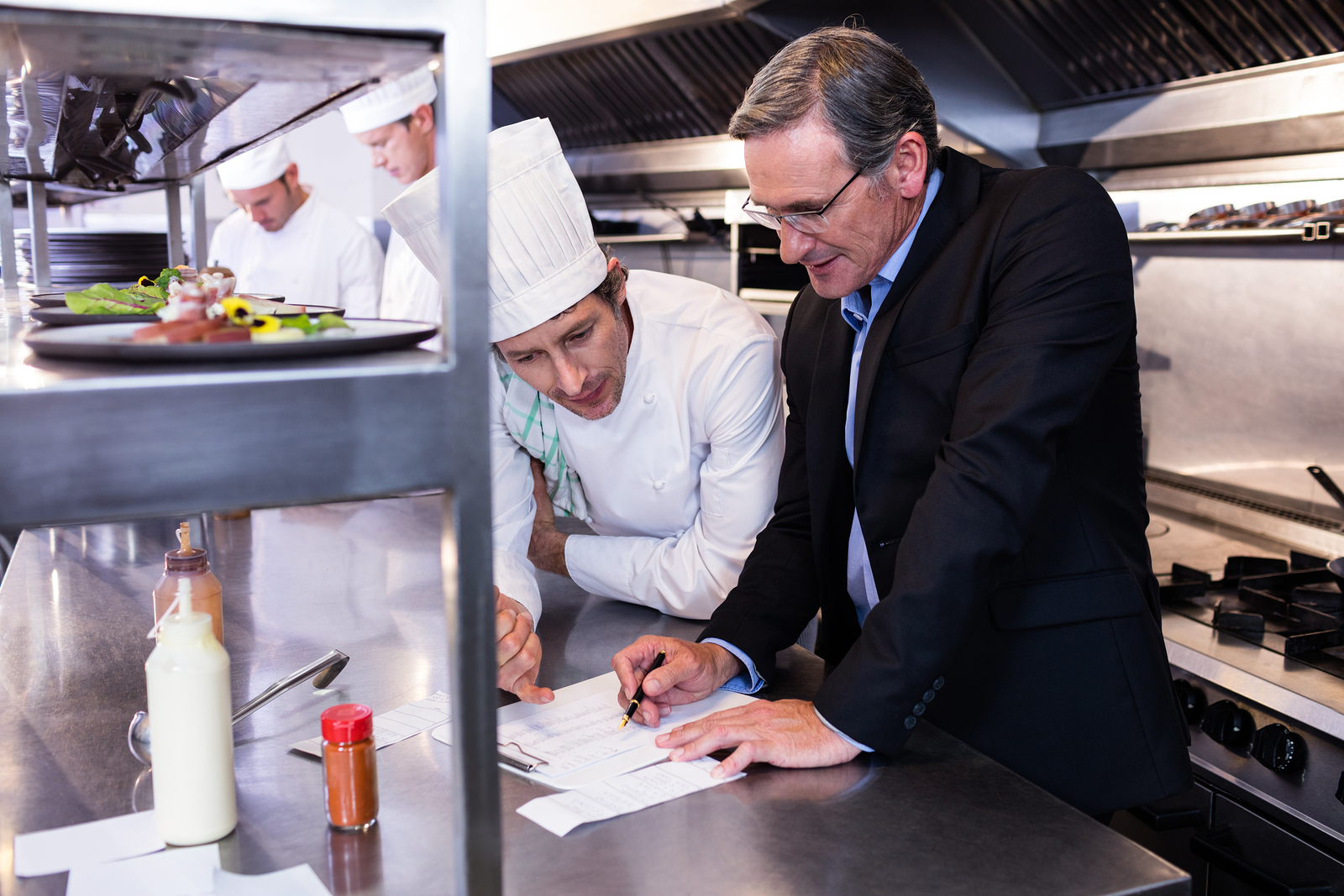 bigstock-Male-restaurant-manager-writin-127550915